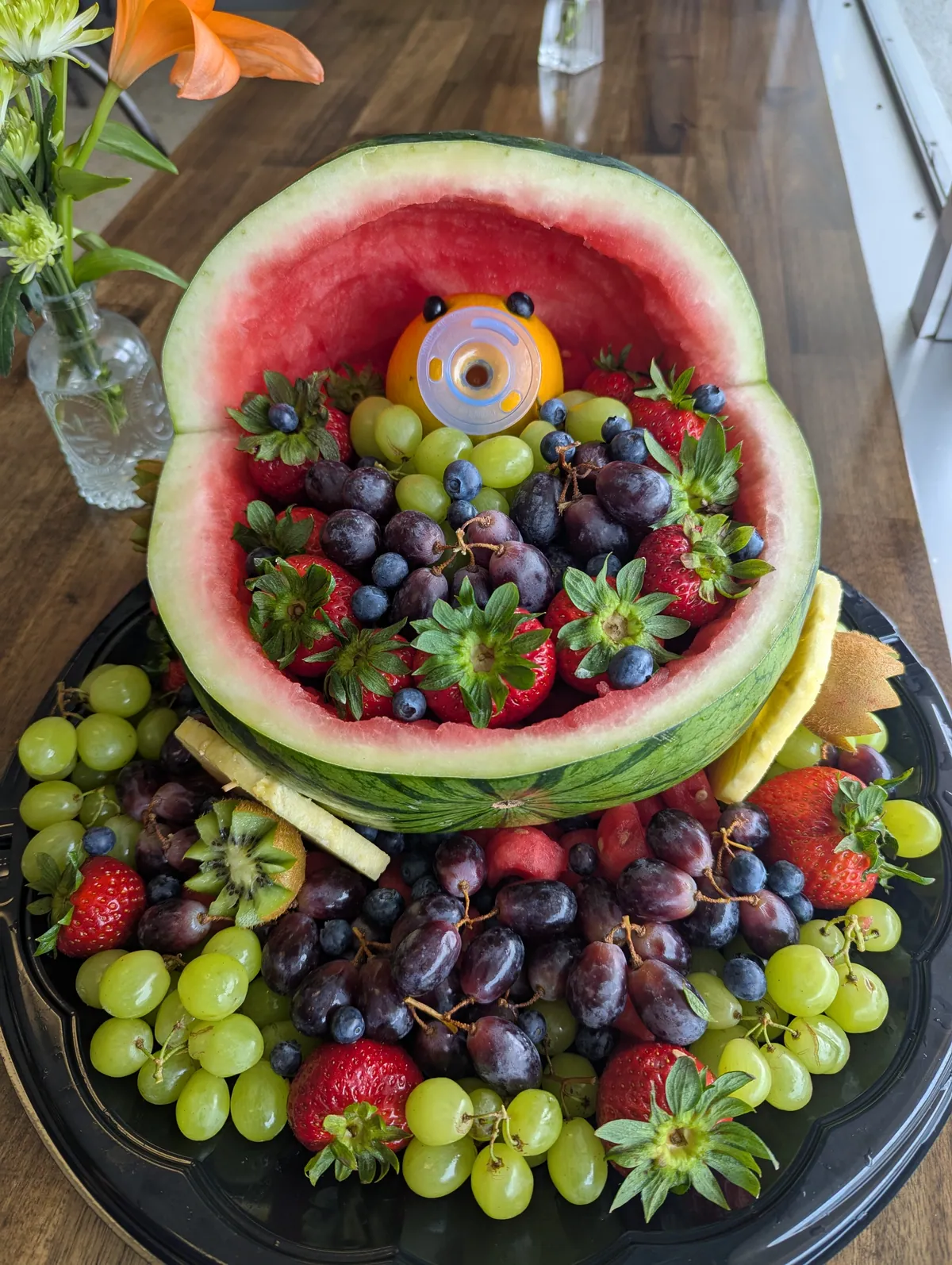 Fresh fruit arranged inside a carved watermelon